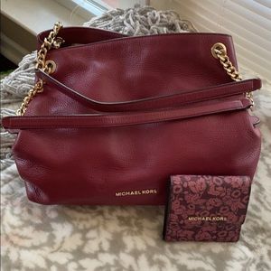 Plum shoulder bag and matching trifold wallet